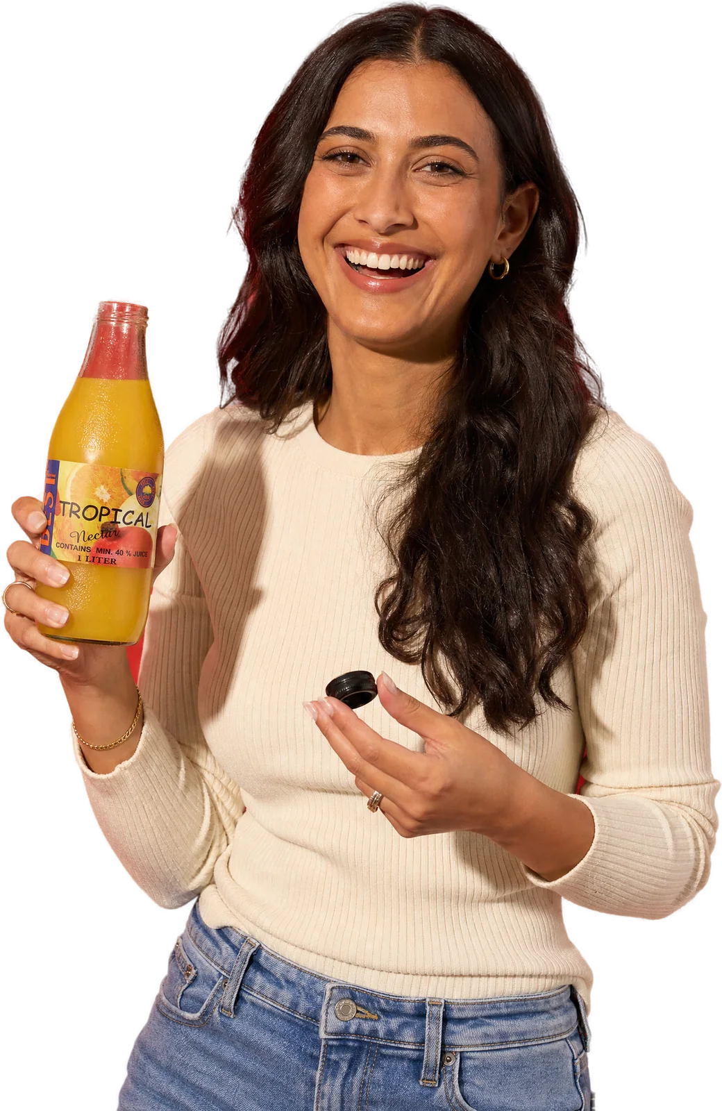 A woman laughing with an opened bottle of BEST Tropical Nectar, its cap in her other hand